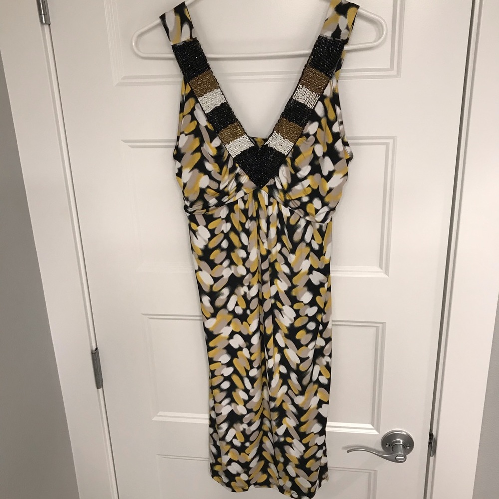 Gold, black, and white dress